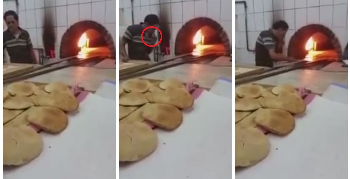 عامل في فرن يدخن اثناء تحضير الخبز